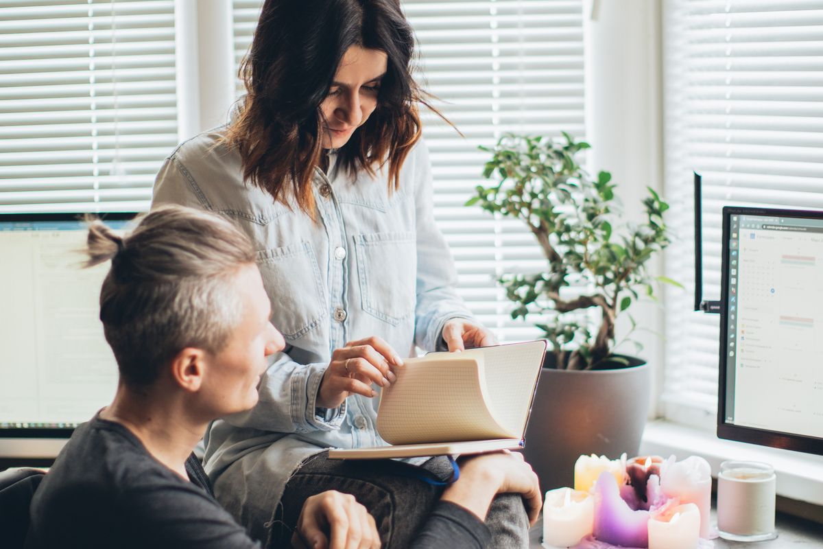 A pair working through the day at a shared desk