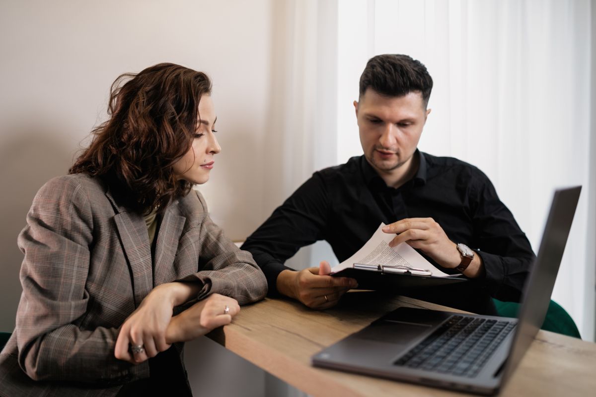 Colleagues working side by side at a desk
